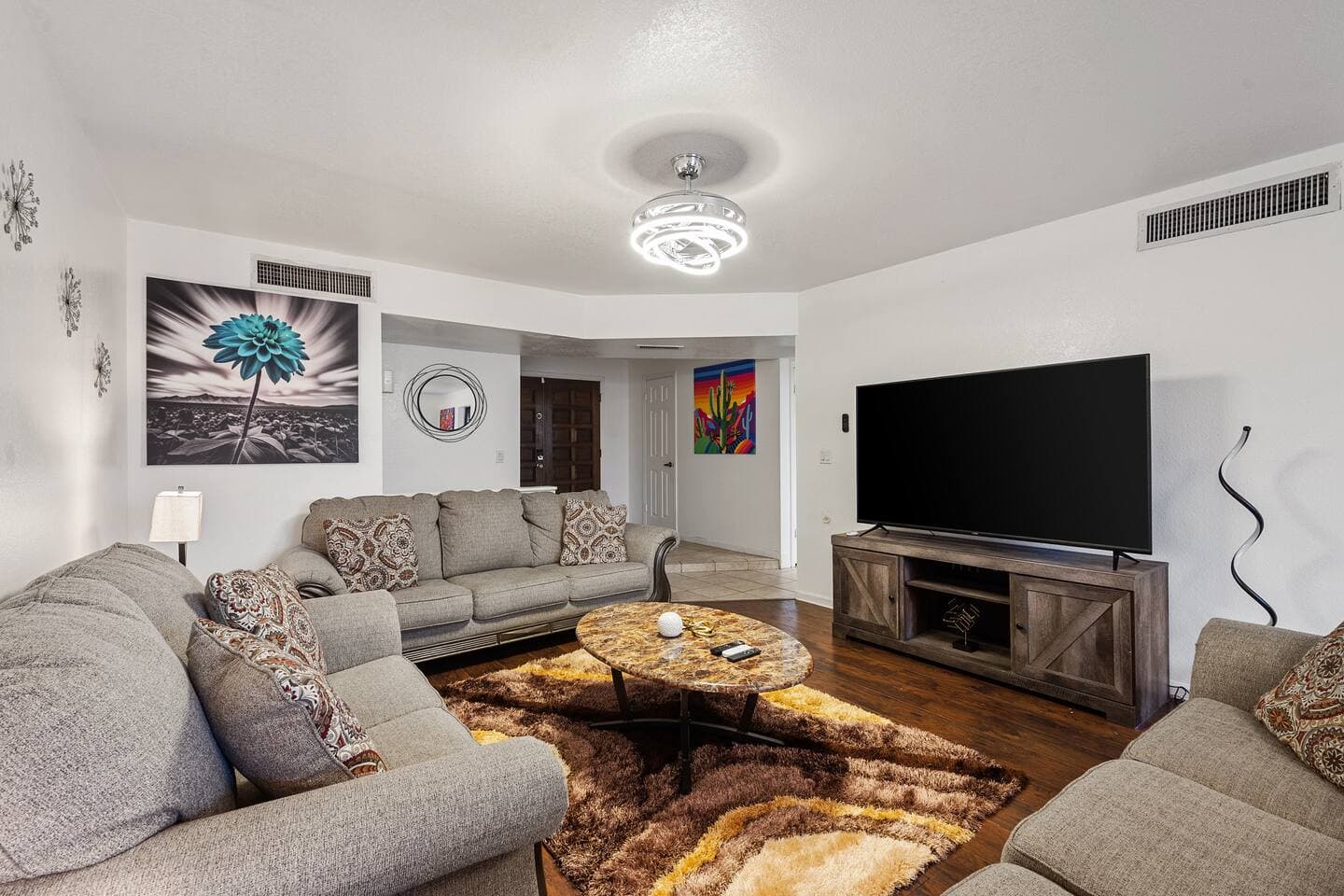 Cozy Gatherings: Dive into comfort in our family room, where seating for eight meets cutting-edge entertainment on a grand smart TV. Perfect for movie nights or cherished family moments.
