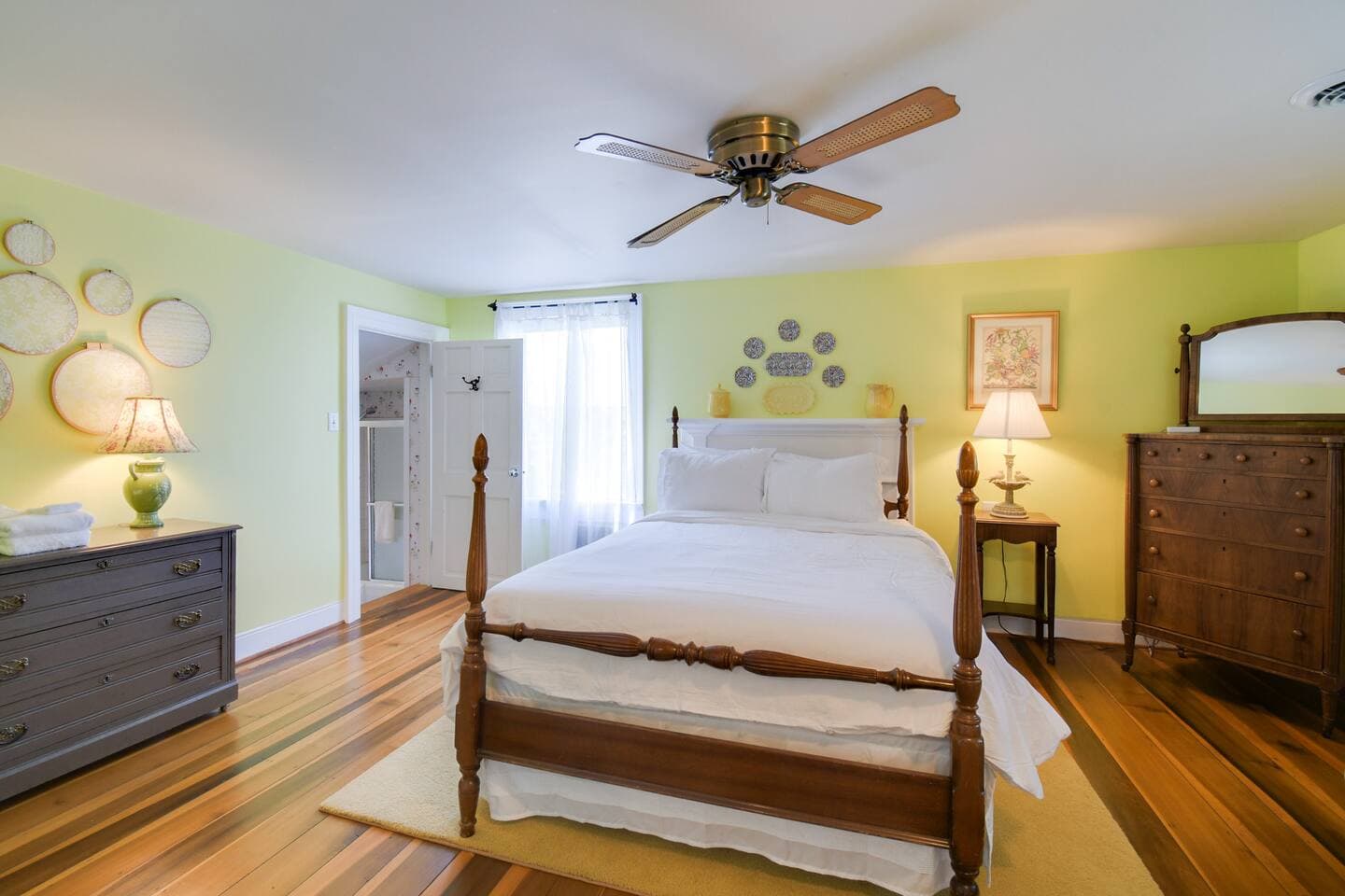 Regal comfort meets rustic charm: our queen bedroom, a masterpiece of farmhouse elegance.